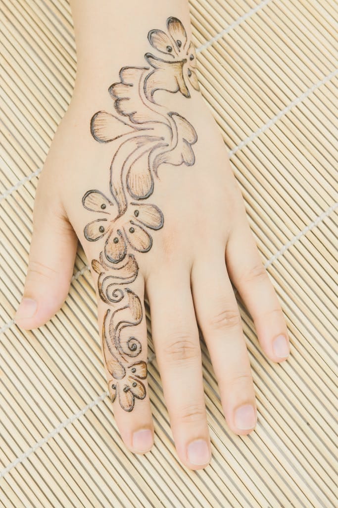 Detailed Arabic henna design  on a woman's hand 