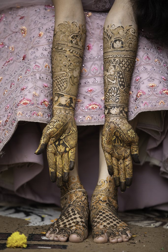 Detailed Rajasthani bridal mehndi designs on hands and feet, showcasing cultural beauty and tradition.
